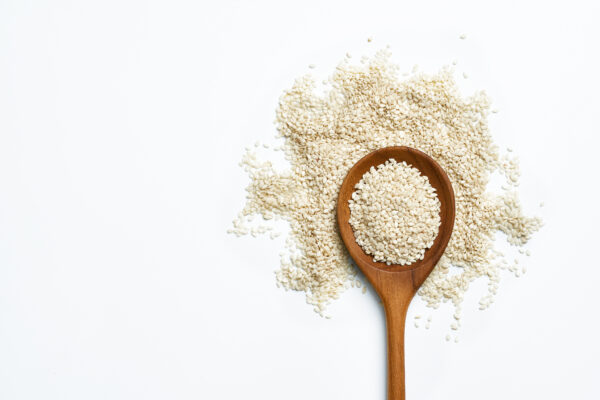 vecteezy top view white sesame seeds with a wooden spoon on white 22880948 scaled